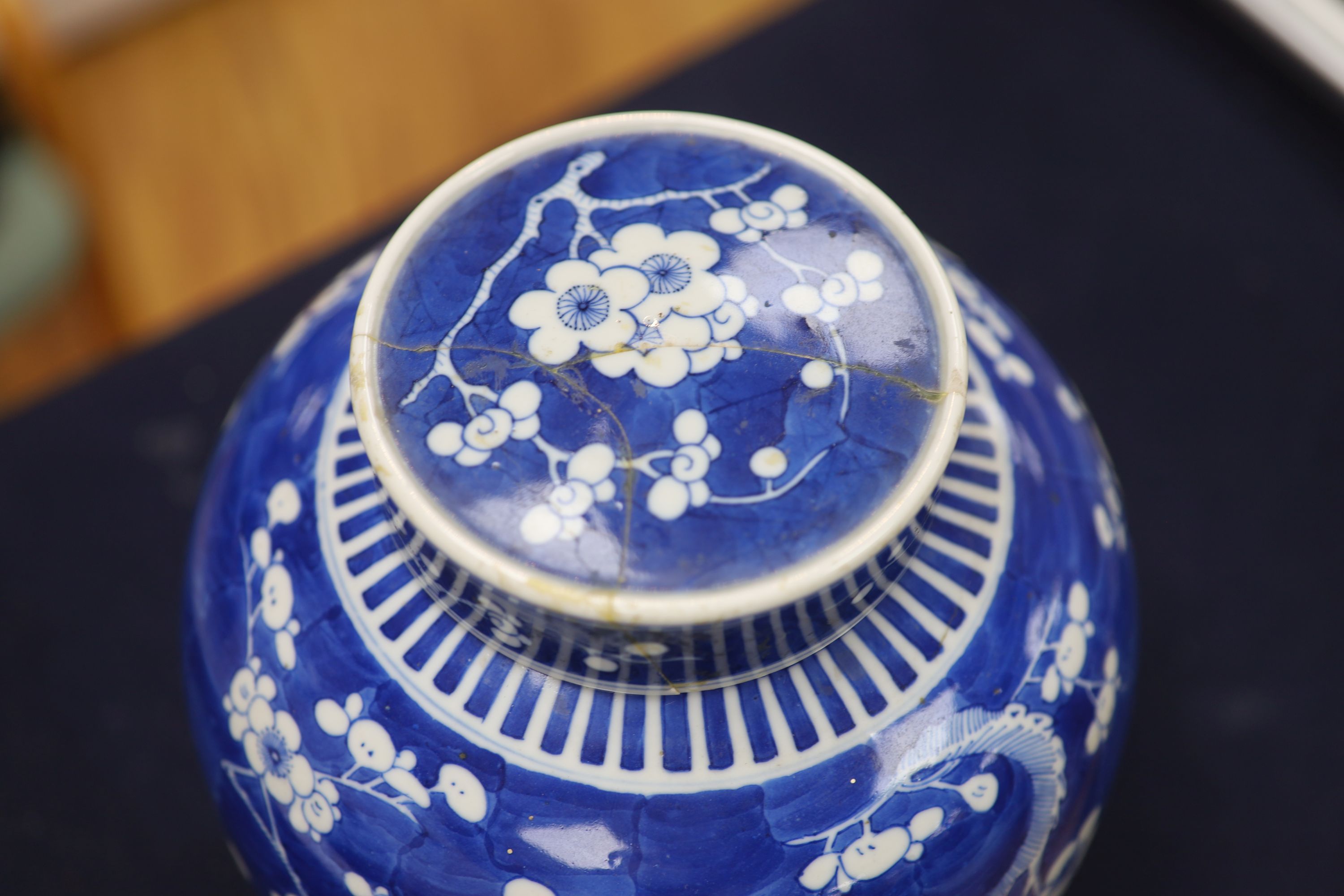 An early 20th century Chinese blue and white prunus jar and cover, height 26cm